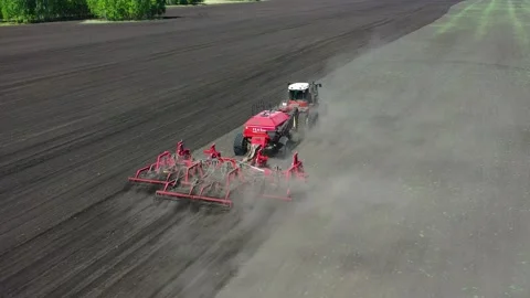 Tractor with sowing complex works in the field Stock Footage 130521931