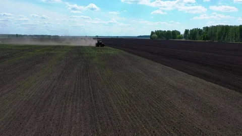 Tractor with sowing complex works in the field planting crops Stock Footage 130523697