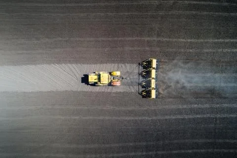 Tractor sowing in the field Stock Photos