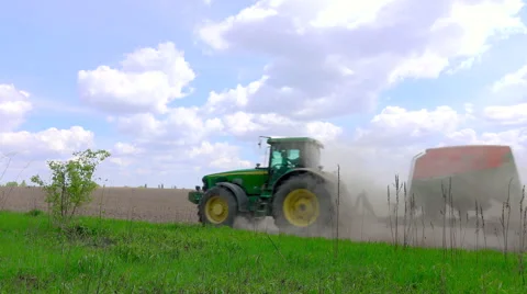 Tractor with sowing machine in the field Stock Footage 62735214