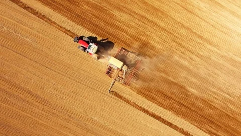 Tractor with sowing machine working on a  field. Stock Footage 105861751