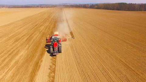 Tractor with sowing machine working on a  field. Video stock 105865029