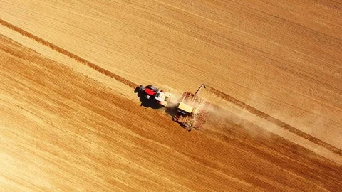 Tractor with sowing machine working on a  field. Video stock 105865647