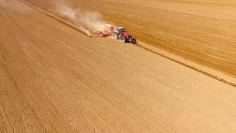 Tractor with sowing machine working on a  field. Video stock 105866210
