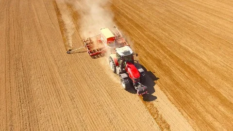 Tractor with sowing machine working on a  field. Video stock 105867789