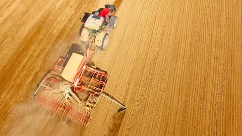 Tractor with sowing machine working on a  field. Video stock 105867937