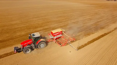 Tractor with sowing machine working on a  field. Video stock 105869640