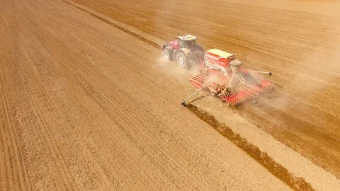 Tractor with sowing machine working on a  field. Video stock 105871583