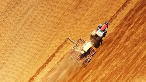 Tractor with sowing machine working on a  field. Video stock 105871955