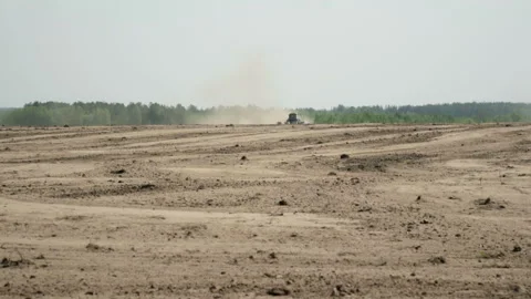 A tractor with a sowing unit produces sowing seeds Stock-Footage 89779647