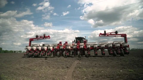 The tractor sows the field with corn grains. Preparation Stock Footage 234423267