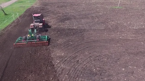 The tractor sows the field. Top view appears in the frame Video stock 78155717