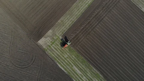 The tractor sows grain in the field. Stock Footage 127761118