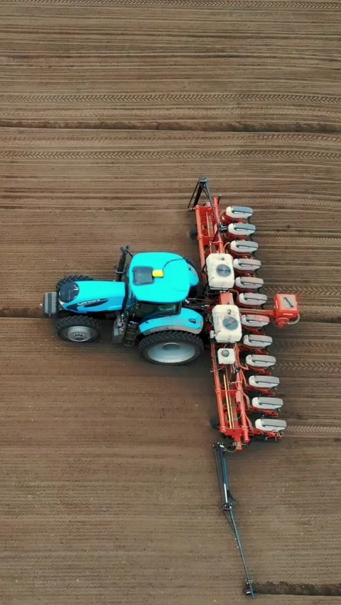 Tractor with special precision planters is working in the field, there is a 库存影片 310562611