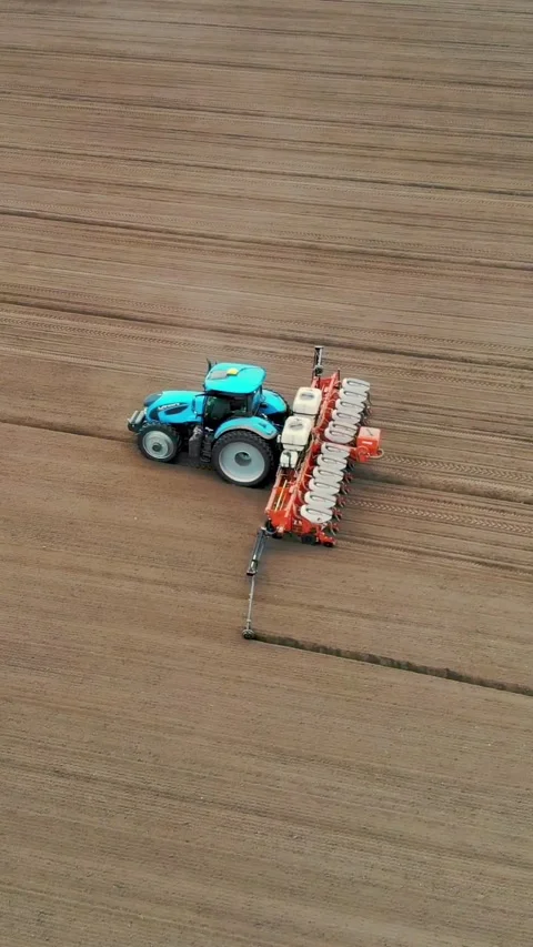 Tractor with special precision planters is working in the field, there is a Video stock 315563437