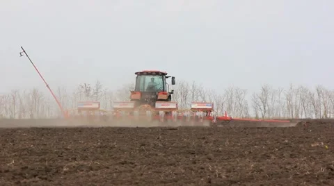 Tractor spend sowing campaign in the field. Stock Footage 62371056