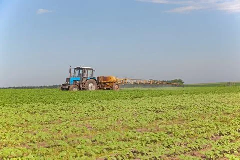 Tractor with a sprayer Stock Photos