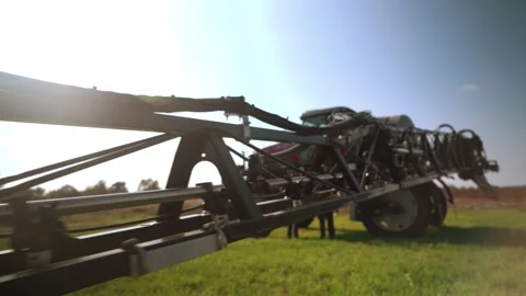 Tractor sprayer is preparing before working in the field. sprayer boom. Stock Footage 234421541