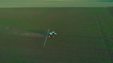Tractor sprayer on soybean fields at sunset. Aerial drone footage. Stock-Footage 214724158