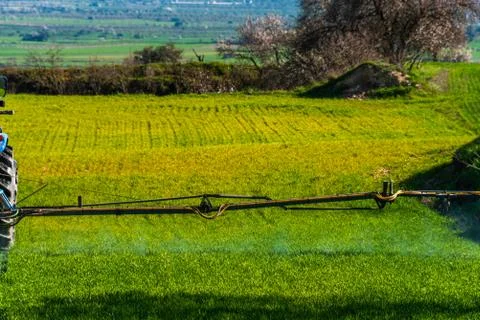 Tractor spraying crops 库存照片