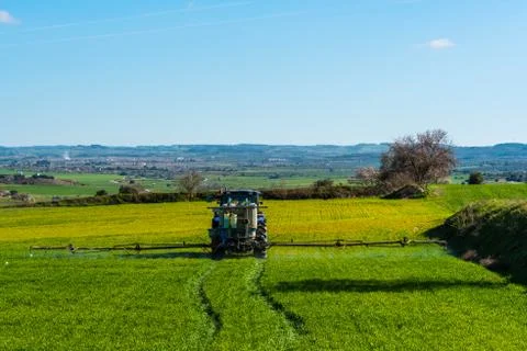 Tractor spraying crops Stock Photos