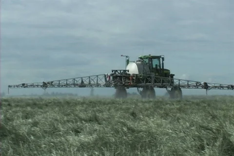 Tractor spraying field Stock-Footage 306440