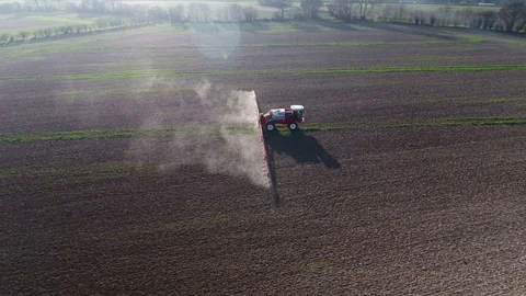 Tractor Spraying Fields on an Arable Farm with Glyphosate Herbicide Stock Footage 81887240