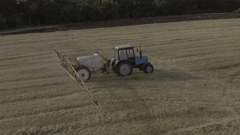 Tractor spraying fields in Ukraine Stock Footage 201445552