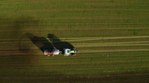 Tractor spraying liquid manure on a field Stock Footage