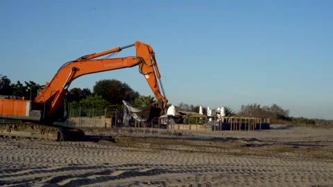 Tractor Spraying Sand and Transporting Water at Lido di Volano Stock Footage 296490349