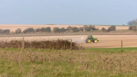 Tractor spreading fertiliser 스톡 동영상 73235463