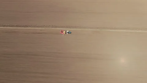 Tractor in the spring on the field Stock Footage 231839674