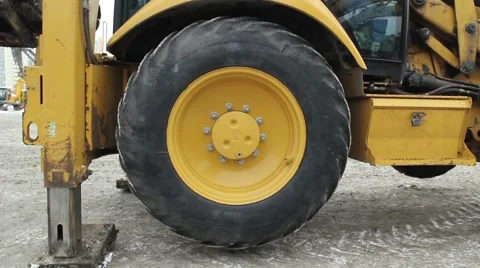 Tractor standing on the steps and turns the rear wheel Stock-Footage 50808468