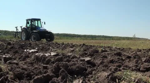 A tractor starts plowing 스톡 동영상 12153729
