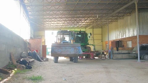 Tractor in the storehouse with wheat Stock Footage 94366237