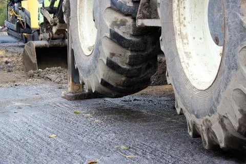 Tractor strong outrigger stabilizing legs extended to stabilize and steady st Stock Photos