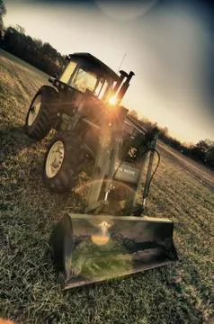 Tractor at sunrise Stock Photos