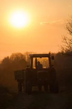 Tractor at sunset 스톡 사진