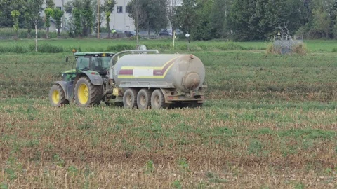 Tractor with tank in action in the field 動画素材 116611233