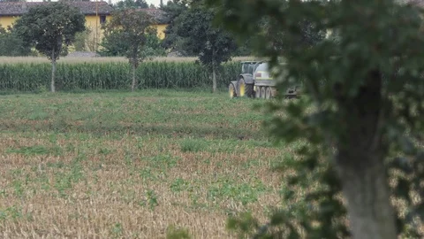 Tractor with tank in action in the field 動画素材 118156990