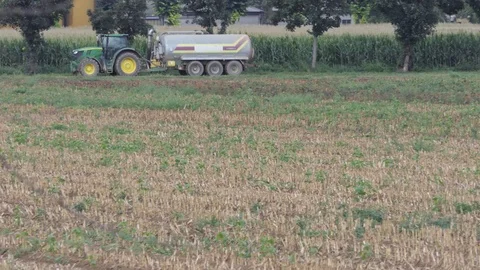Tractor with tank in action in the field 動画素材 118157170