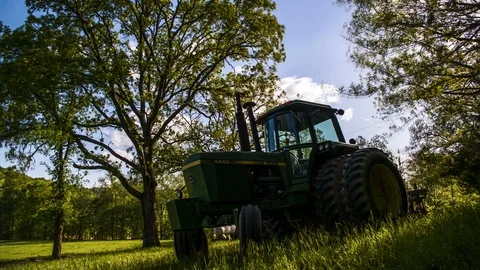 Tractor time-lapse with trees and clouds Video stock 92441756