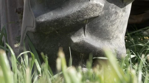 Tractor tire in moving grass medium closeup 4k Stock Footage 108067079