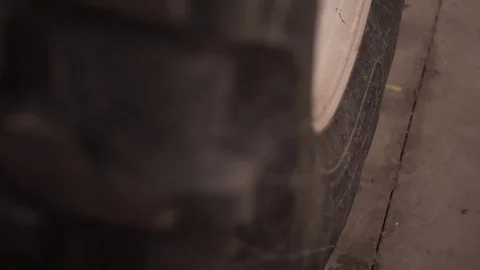Tractor Tire Tread Close Up Hand Held Depth Of Field Focus Shift Dusty Wheel Stock Footage 87845778