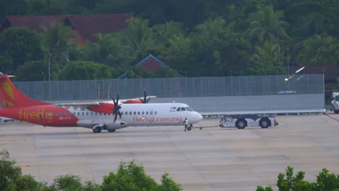 Tractor towing ATR 72 of Firefly Stock Footage 242946828