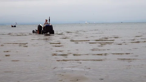Tractor towing a boat Stock Footage 93019052