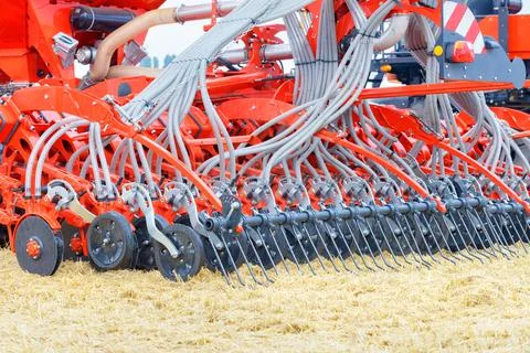 Tractor trailed agricultural unit multi row disc harrow with a mechanism for  Stock Photos