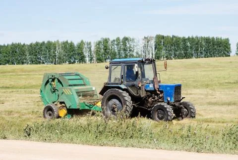 Tractor with trailed stacker, haymaking Stock Photos