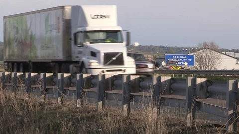 Tractor trailer blown over in severe wind and thunderstorm on highway Stock Footage 75774463
