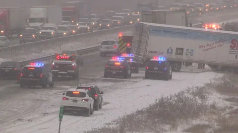 Tractor trailer in ditch in severe snow storm and blizzard Stock Footage 44979992